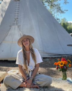Angie Rose in front of a tipi